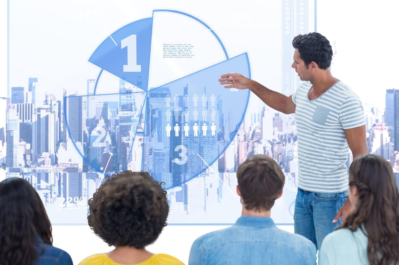 A presenter points to a large screen displaying a pie chart with figures over a cityscape, facing an audience with their backs shown.